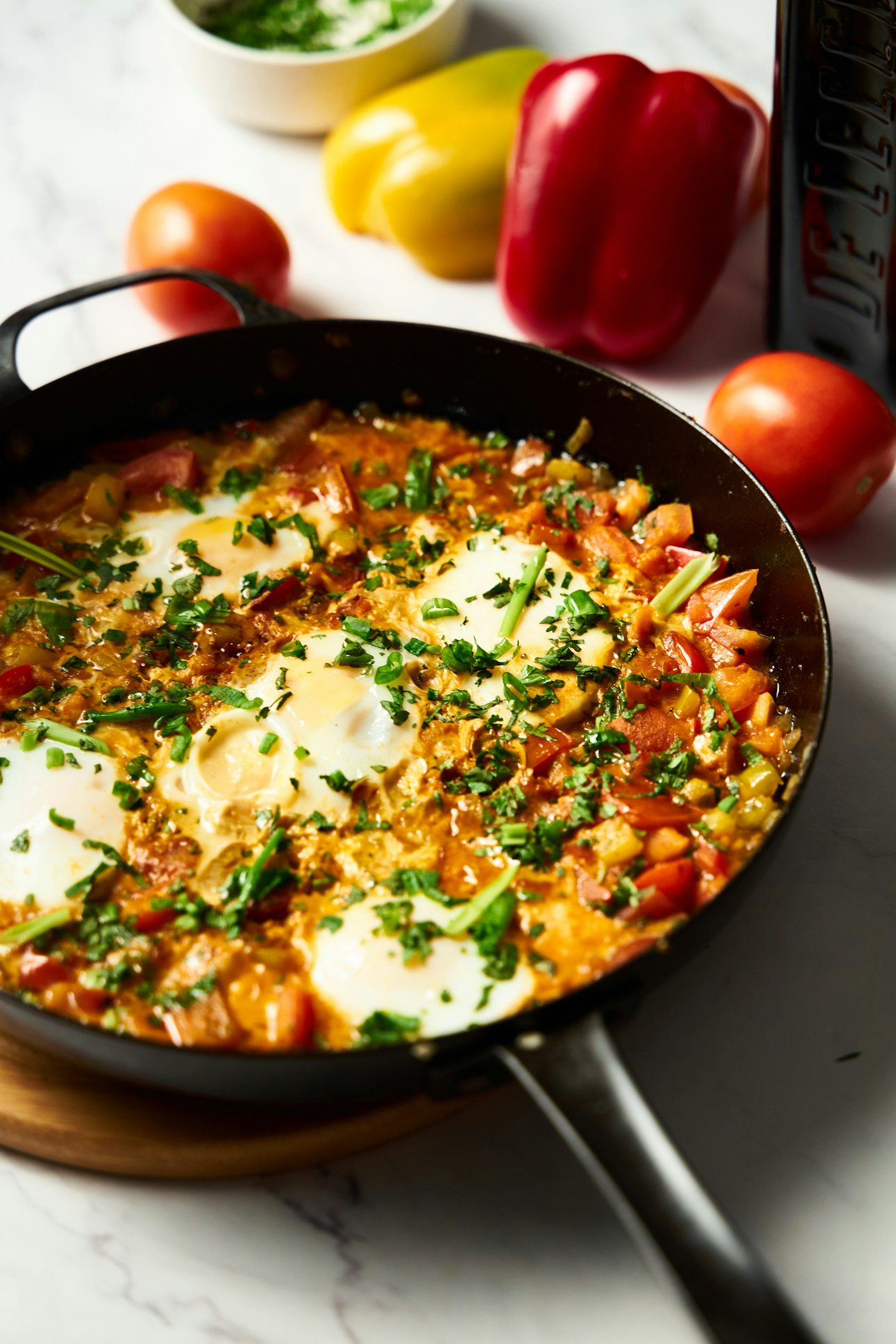 Shakshuka with eggs in tomato sauce in a skillet