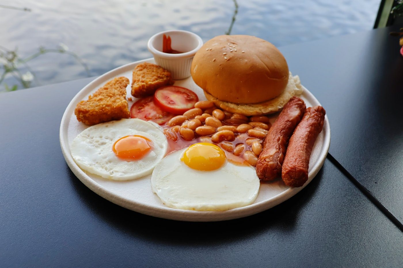 Full English breakfast with eggs, sausages, beans and hash browns
