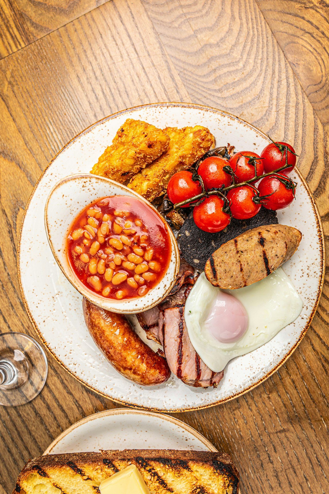 Breakfast plate with egg, sausage and sides
